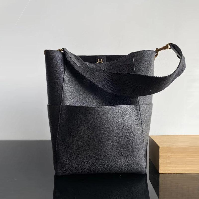Black genuine leather bucket bag with suede lining and gold hardware