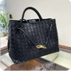 Black knotted intrecciato lambskin leather shoulder bag side view